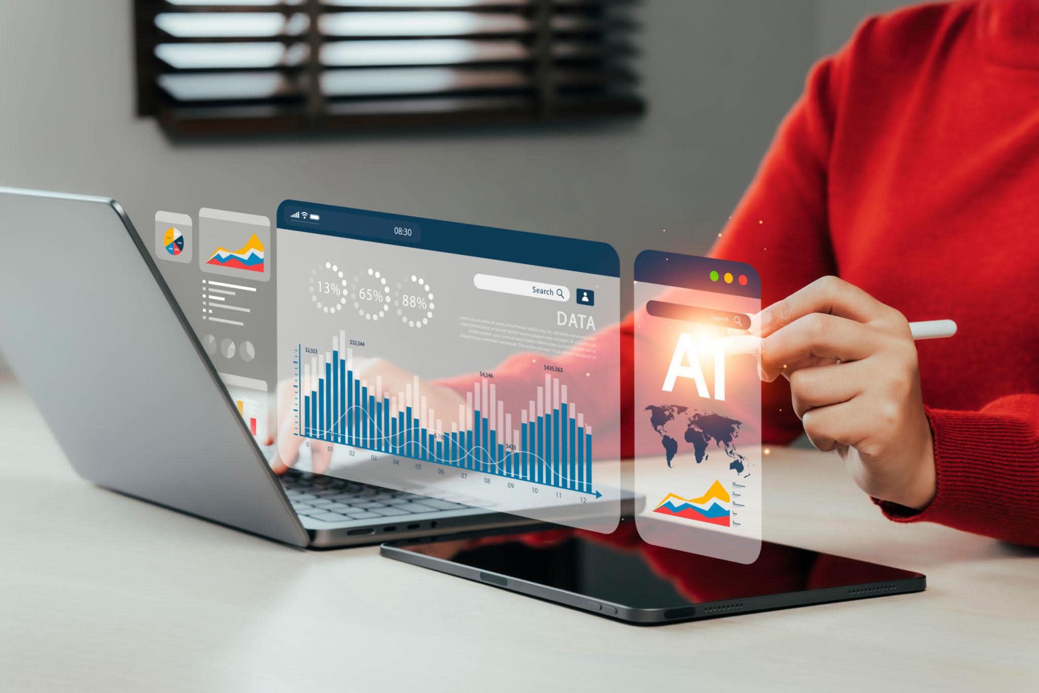 Analyst working with a candidate mapping dashboard showing data visualisations, executive profiles and search insights