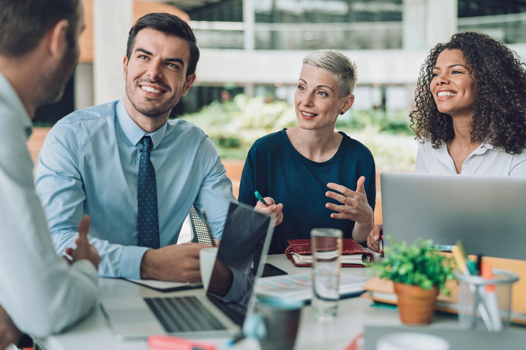 Diverse team of business professionals collaborating in a positive working session
