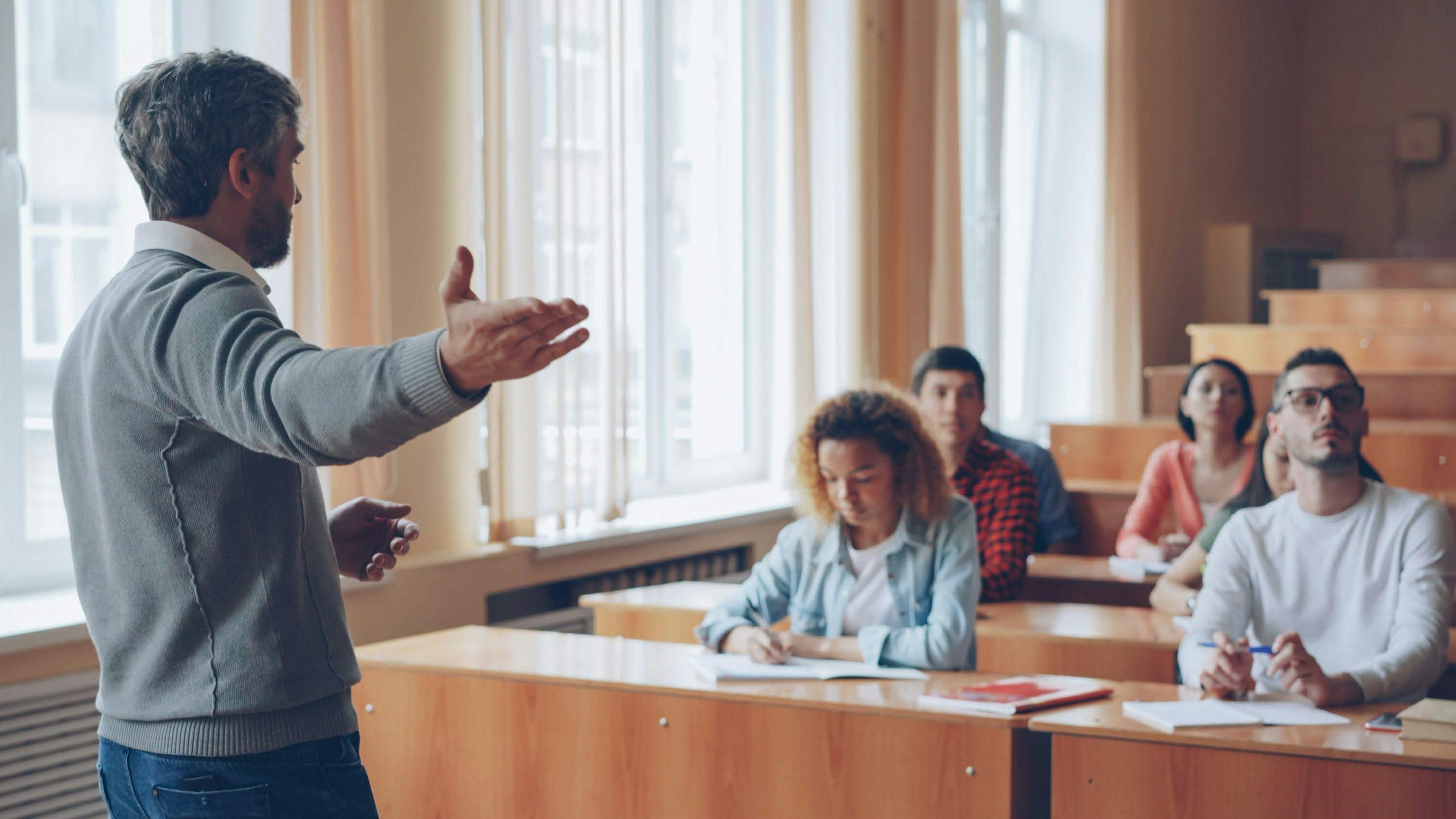 Faculty member leading an engaging in-class executive education session